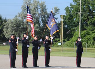 Fireman with Flags and Salute